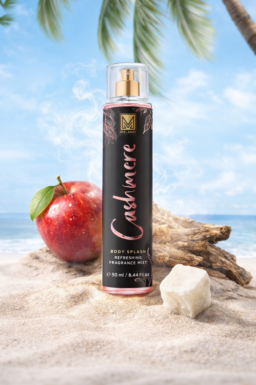 Cashmere body splash bottle with an apple on a beach background